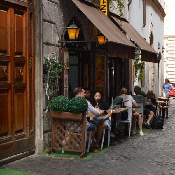 People eating at tables in Rome