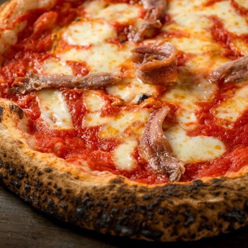 A pizza with anchovy